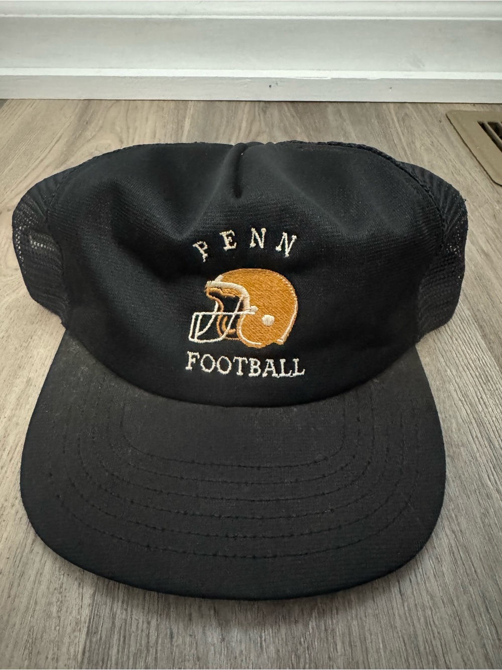Penn Football Black Trucker Hat with Gold Helmet Logo
